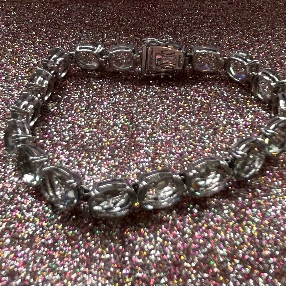 Pretty sterling silver bracelet with light green stones.